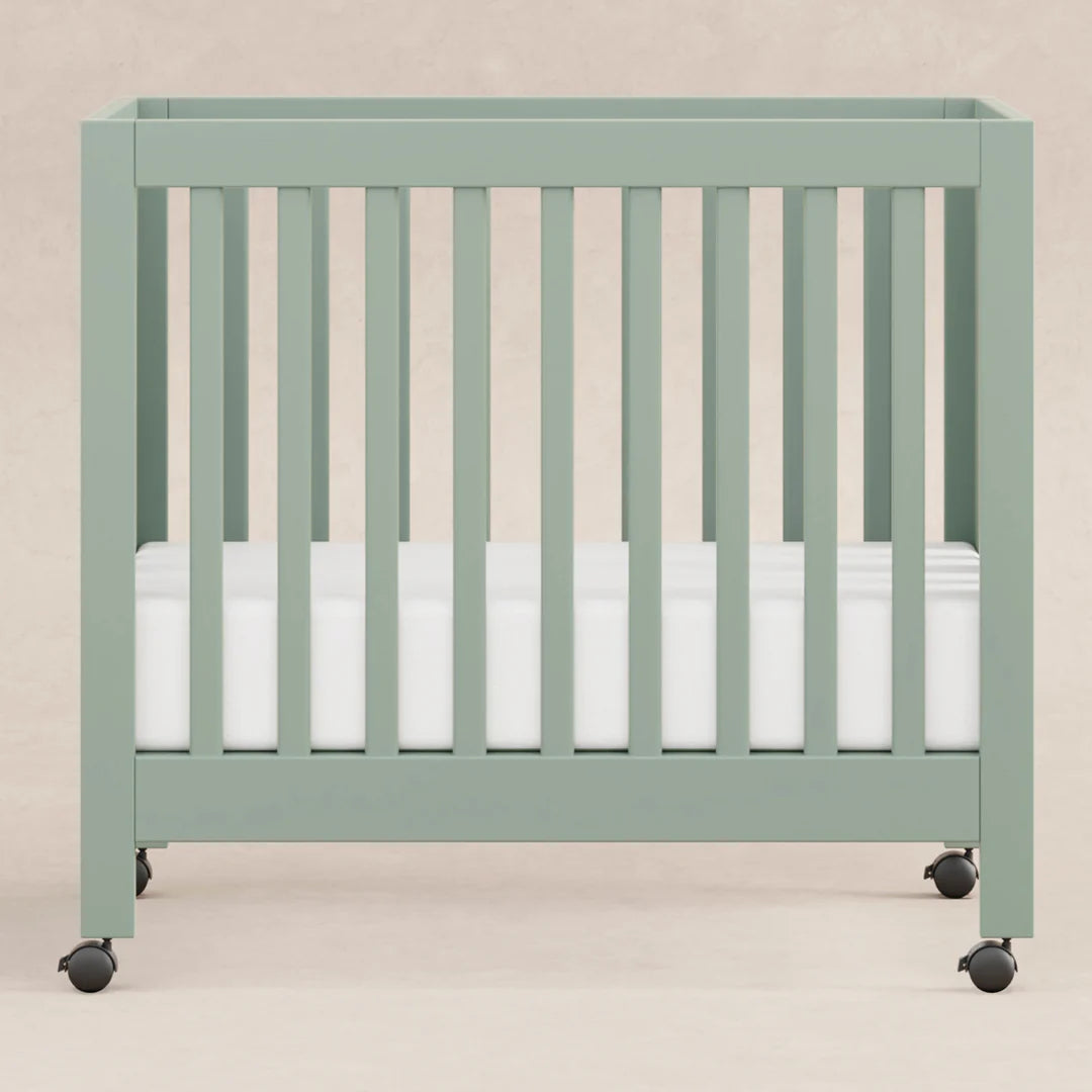 Babyletto Light Sage Origami Portable Mini Crib for Modern Families