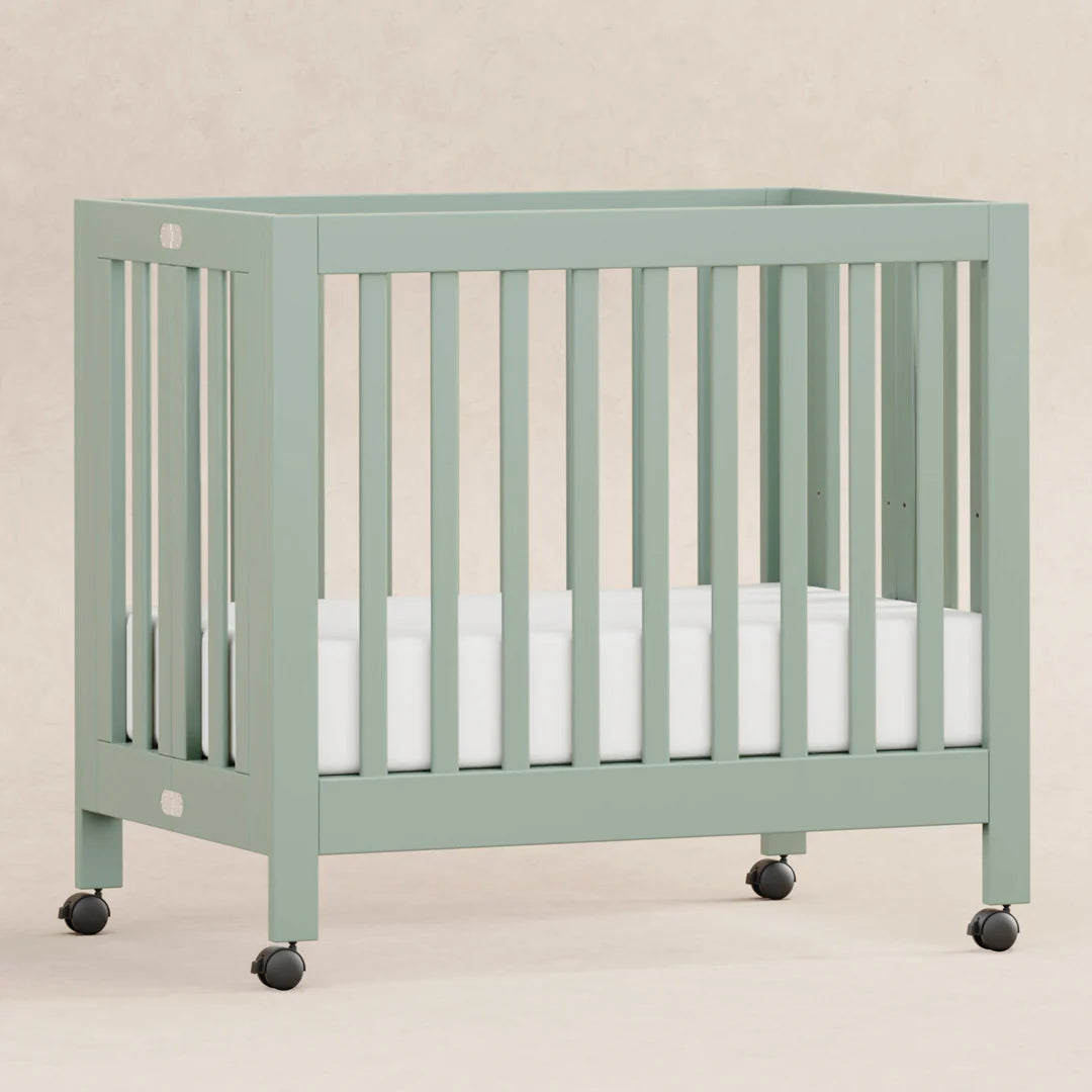 Babyletto Light Sage Origami Portable Mini Crib for Modern Families