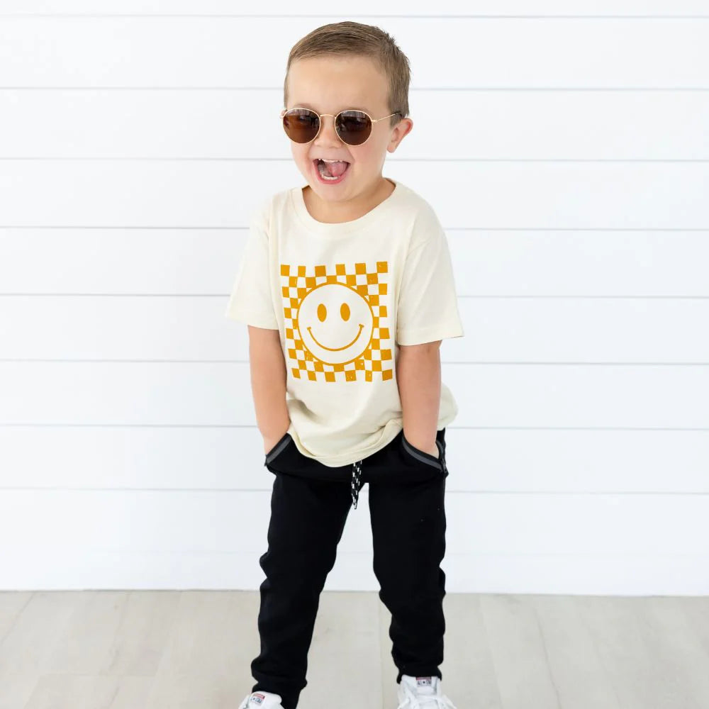 Trendy Sweet Wink Hazel Smiley Checker Short Sleeve Toddler Unisex T-Shirt in Natural Color